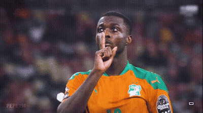 A Soccer Player Wearing A Green And Orange Jersey With Carlsberg On It GIF