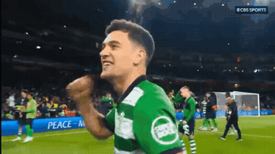 A Soccer Player Wearing A Green And White Jersey With The Word Sports On It GIF