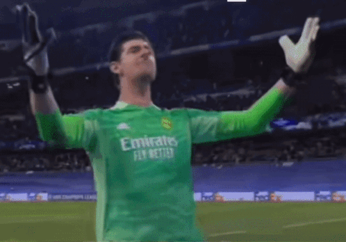 A Soccer Player Wearing A Green Jersey That Says " Emirates Fly Better " GIF