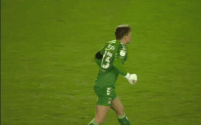 A Soccer Player Wearing A Green Jersey With The Number 13 On It Is Standing On The Field . GIF