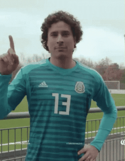 A Soccer Player Wearing A Green Jersey With The Number 13 On It GIF