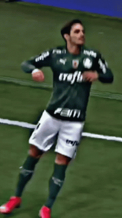 A Soccer Player Wearing A Green Jersey With The Number 28 On It GIF