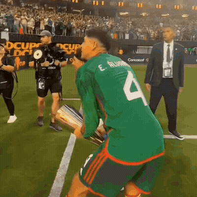 A Soccer Player Wearing A Green Jersey With The Number 4 On The Back GIF