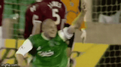 A Soccer Player Wearing A Green Jersey With The Number 5 On It GIF