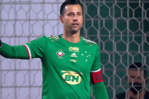 A Soccer Player Wearing A Green Shirt With Bh On The Front GIF
