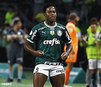A Soccer Player Wearing A Green Shirt With Crefisa On The Sleeves GIF