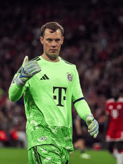 A Soccer Player Wearing A Green Shirt With The Letter T On It GIF