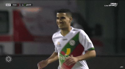 A Soccer Player Wearing A Jako Jersey Celebrates With Another Player GIF