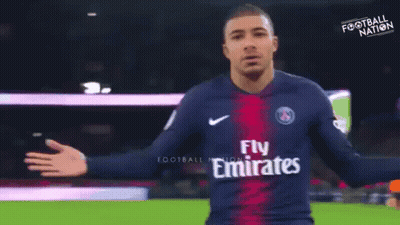 A Soccer Player Wearing A Jersey That Says Fly Emirates On It GIF