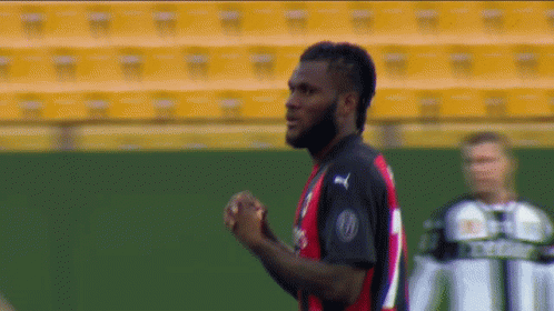 A Soccer Player Wearing A Jersey That Says Fly Emirates On The Front GIF