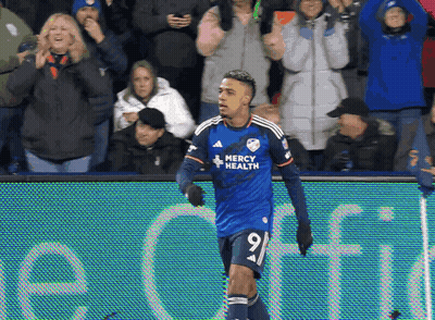 A Soccer Player Wearing A Jersey That Says Mercy Health On It GIF