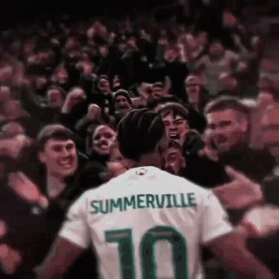 A Soccer Player Wearing A Jersey With The Number 10 On It Is Surrounded By Fans . GIF