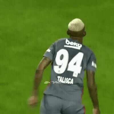 A Soccer Player Wearing A Jersey With The Number 94 On The Back GIF