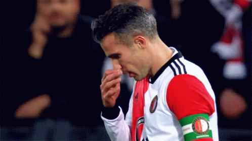 A Soccer Player Wearing A Jersey With The Word Feyenoord On The Armband GIF