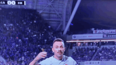 A Soccer Player Wearing A Kyocera Jersey Celebrates GIF