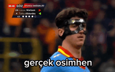 A Soccer Player Wearing A Mask With The Words Gerçek Osimhen Written Below Him GIF