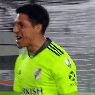 A Soccer Player Wearing A Neon Green Jersey That Says Rrish On It GIF