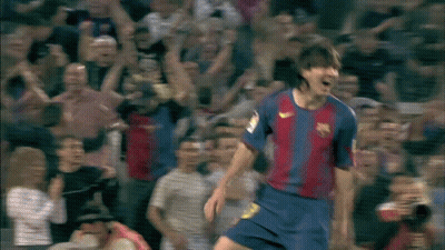 A Soccer Player Wearing A Nike Jersey Is Celebrating A Goal In Front Of A Crowd GIF
