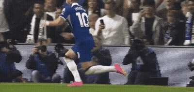 A Soccer Player Wearing A Number 10 Jersey Is Running On The Field GIF