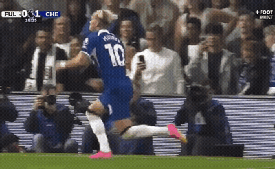 A Soccer Player Wearing A Number 10 Jersey Is Running On The Field . GIF