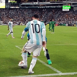 A Soccer Player Wearing A Number 10 Jersey Kicks The Ball GIF