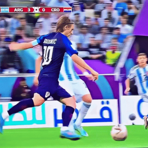 A Soccer Player Wearing A Number 10 Jersey Kicks The Ball GIF