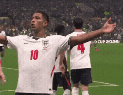 A Soccer Player Wearing A Number 10 Jersey Stands On A Field With His Arms Outstretched GIF