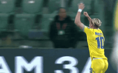 A Soccer Player Wearing A Number 11 Jersey Celebrates A Goal GIF