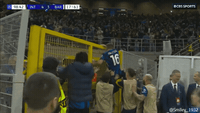 A Soccer Player Wearing A Number 16 Jersey Is Jumping Over A Fence GIF
