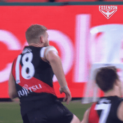 A Soccer Player Wearing A Number 18 Jersey Is Kicking The Ball GIF