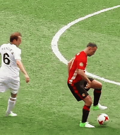 A Soccer Player Wearing A Number 6 Jersey Kicks The Ball GIF