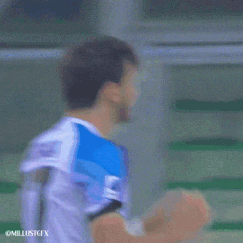A Soccer Player Wearing A Number 77 Jersey Covers His Face With His Hands GIF