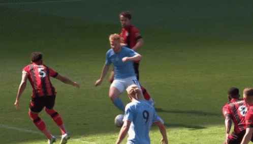 A Soccer Player Wearing A Number 9 Jersey Kicks The Ball GIF