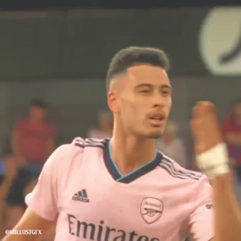 A Soccer Player Wearing A Pink Jersey With Emirates On It GIF