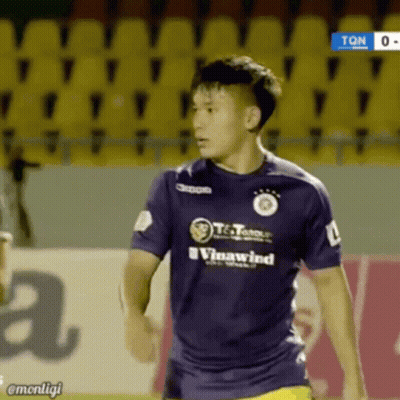 A Soccer Player Wearing A Purple Shirt That Says Vinawind On It GIF
