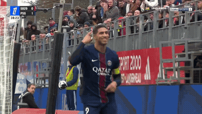 A Soccer Player Wearing A Qatar Airlines Jersey Stands In Front Of A Crowd GIF