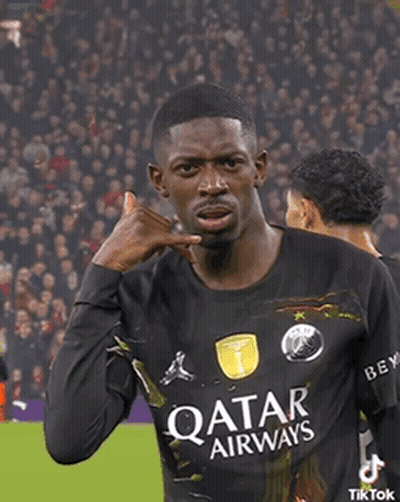 A Soccer Player Wearing A Qatar Airways Jersey Is Making A Call Me Gesture GIF