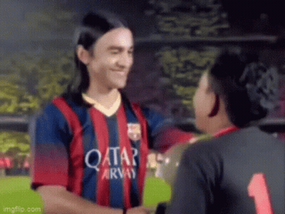A Soccer Player Wearing A Qatar Airways Jersey Is Shaking Hands With Another Player On A Field . GIF