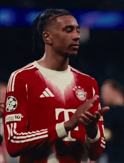 A Soccer Player Wearing A Red Adidas Jersey Is Clapping GIF