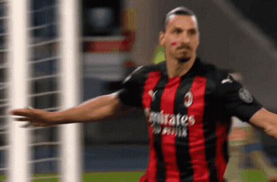 A Soccer Player Wearing A Red And Black Jersey That Says Emirates GIF