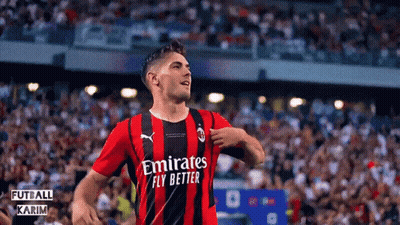 A Soccer Player Wearing A Red And Black Jersey With Emirates Fly Better On It GIF