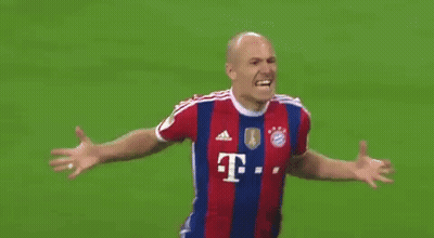 A Soccer Player Wearing A Red And Blue Striped Jersey With The Letter T On It GIF