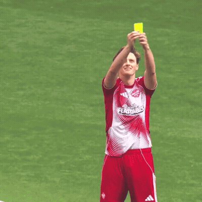 A Soccer Player Wearing A Red And White Jersey That Says Fastble Holds Up A Yellow Card GIF