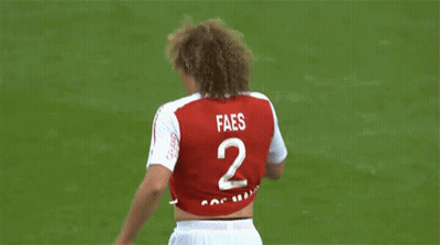 A Soccer Player Wearing A Red And White Jersey That Says Restez A La Maison GIF