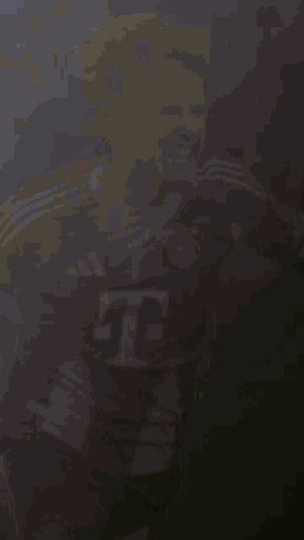 A Soccer Player Wearing A Red And White Jersey With The Letter T On The Front GIF