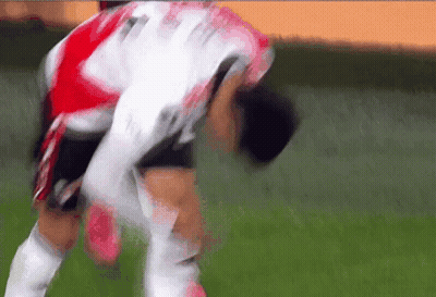 A Soccer Player Wearing A Red And White Jersey With The Number 11 On It GIF