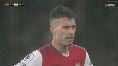 A Soccer Player Wearing A Red And White Jersey With The Word Arsenal On The Front GIF