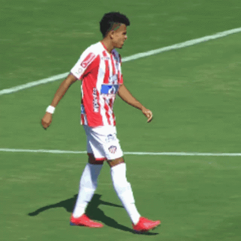 A Soccer Player Wearing A Red And White Striped Jersey That Says ' I Love ' On It GIF