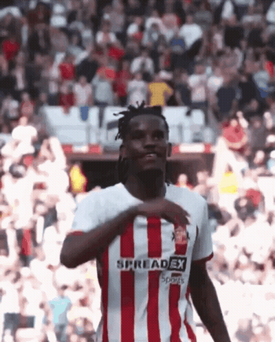 A Soccer Player Wearing A Red And White Striped Jersey That Says Spreadex Sports GIF