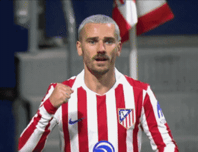 A Soccer Player Wearing A Red And White Striped Jersey With The Letters Atm On The Front GIF